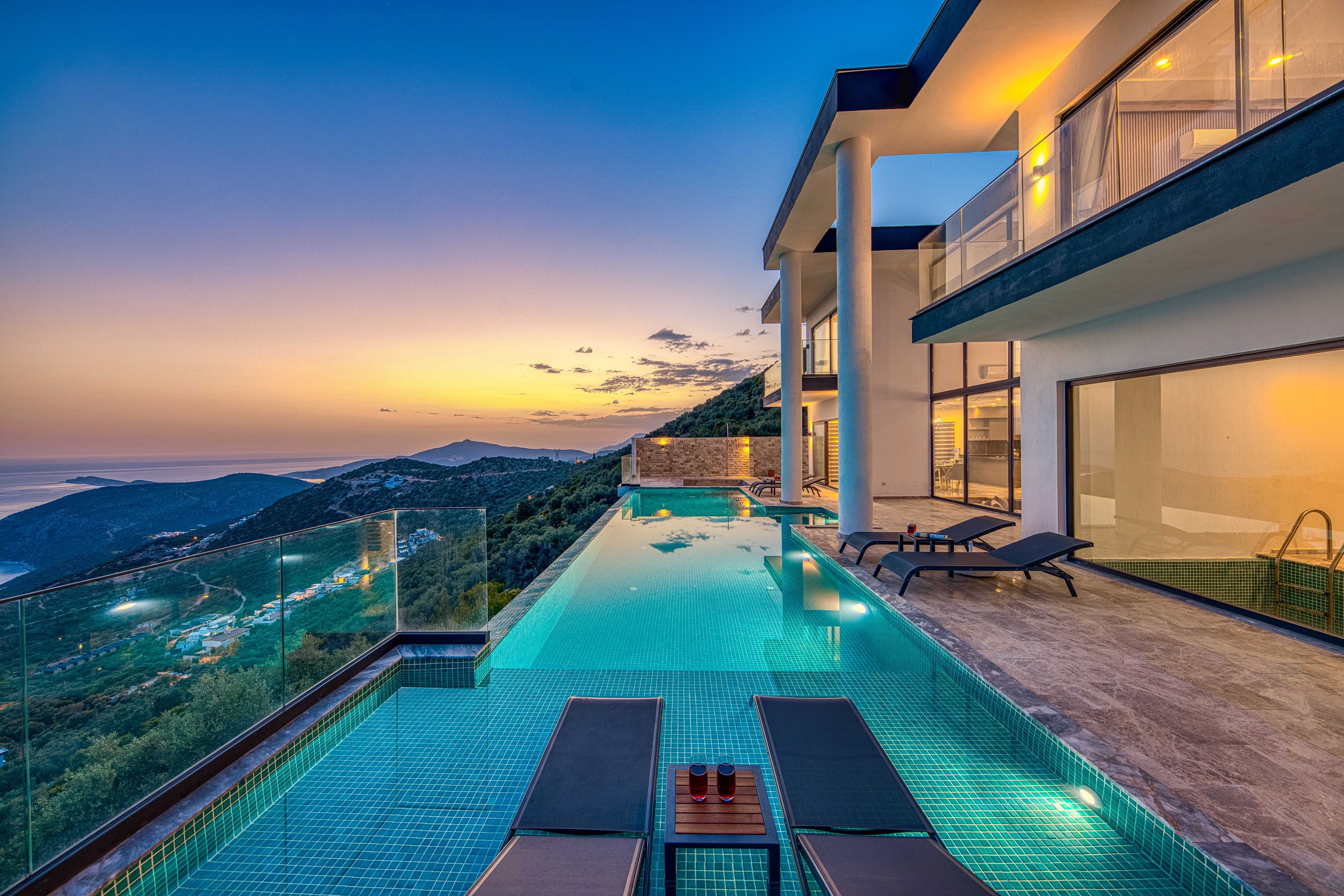 Private clifftop villa and infinity pool at sunset
